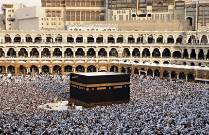 What is the significance of head-shaving at the end of Hajj or Umrah?